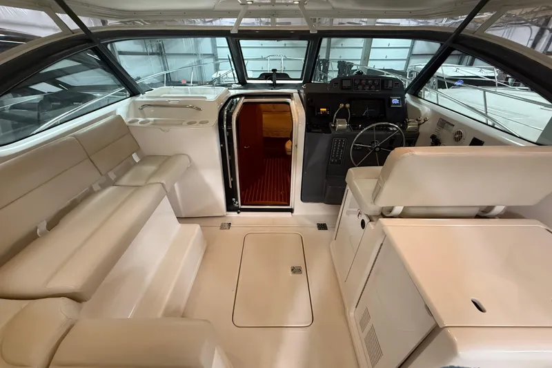 Slide: The Image of 2004 Tiara Yachts 3800 Open in a showroom, showcasing sleek design and advanced features. - 16