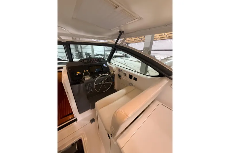 Slide: The Image of 2004 Tiara Yachts 3800 Open interior with beige seating and modern design. - 21