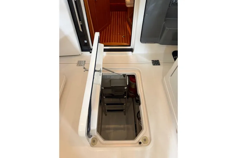 Slide: The Image of 2004 Tiara Yachts 3800 Open boat interior with spacious seating and storage compartments. - 24