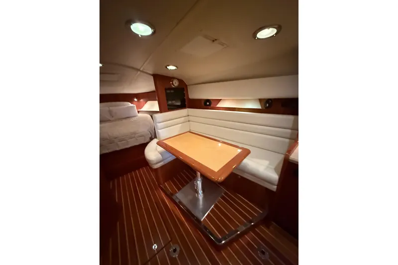 Slide: The Image of 2004 Tiara Yachts 3800 Open boat deck with storage compartments and seating. - 26