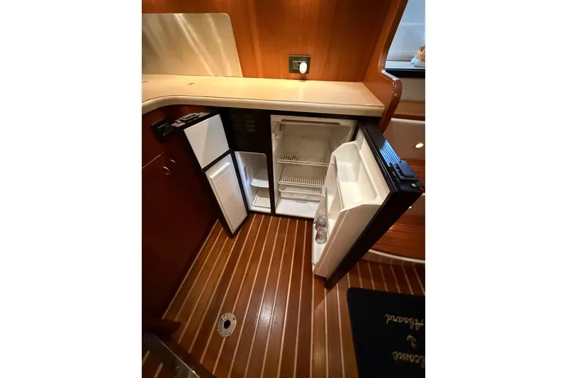 Slide: The Image of 2004 Tiara Yachts 3800 Open boat interior with storage compartments and seating. - 29
