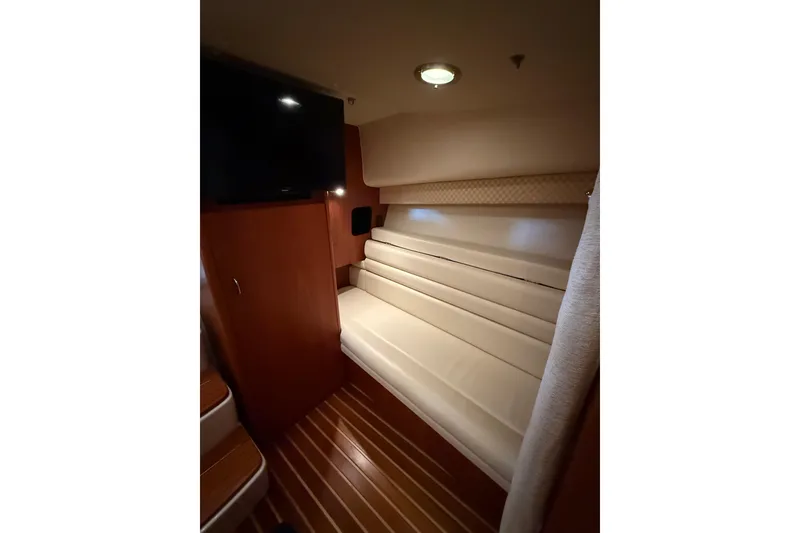 Slide: The Image of 2004 Tiara Yachts 3800 Open boat interior with spacious seating and storage compartments. - 32