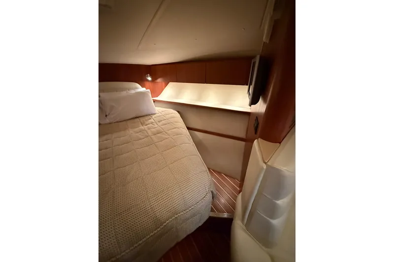 Slide: The Image of 2004 Tiara Yachts 3800 Open interior with helm, seating, and cabin entrance. - 35