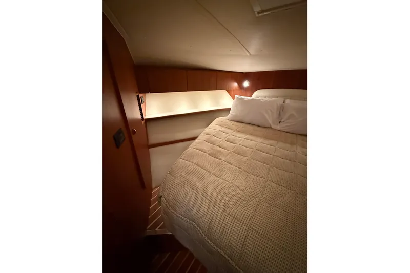 Slide: The Image of 2004 Tiara Yachts 3800 Open cockpit with helm station and seating area. - 36