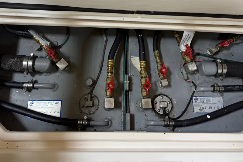 Slide: The Image of 2004 Tiara Yachts 3800 Open helm with modern navigation controls and steering wheel. - 42