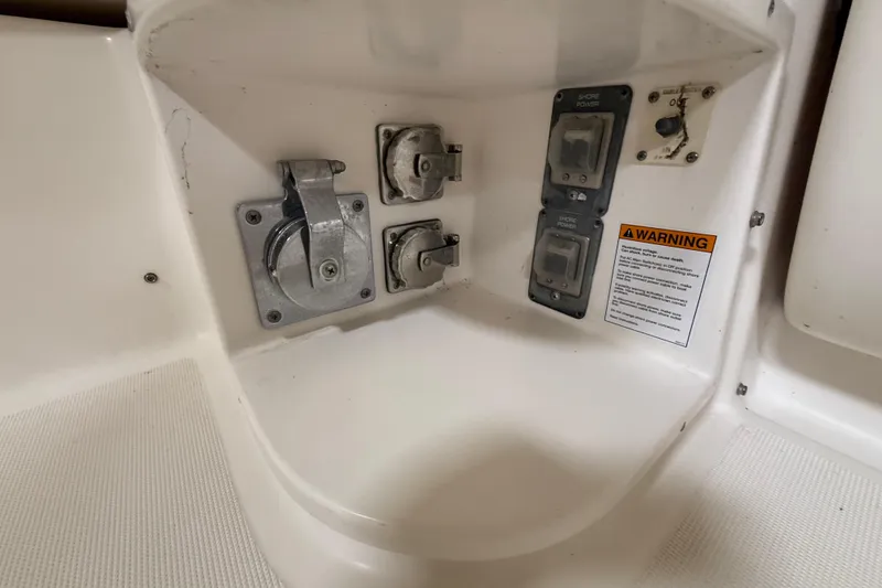 Slide: The Image of 2004 Tiara Yachts 3800 Open helm with navigation controls and display screens. - 43