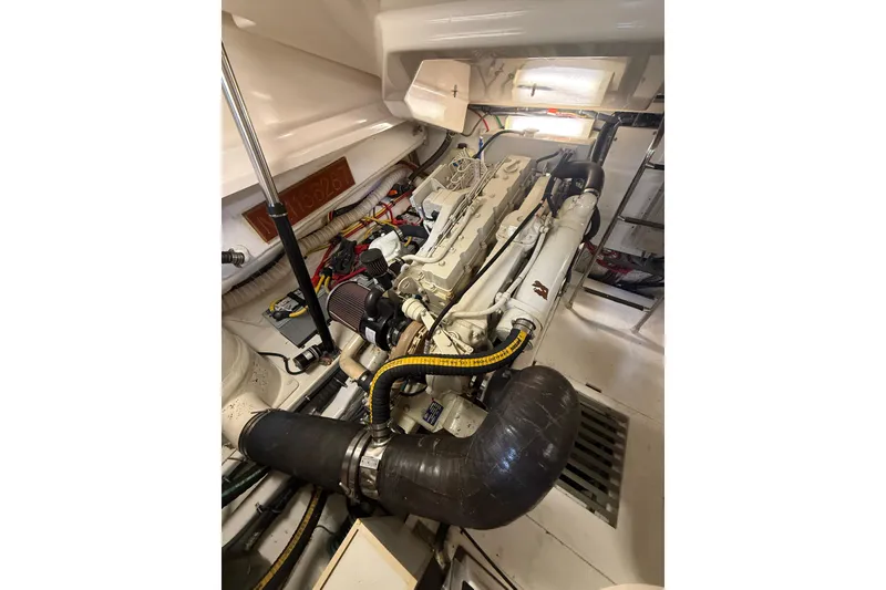 Slide: The Image of Interior of 2004 Tiara Yachts 3800 Open, featuring a cozy dining area and bed. - 46