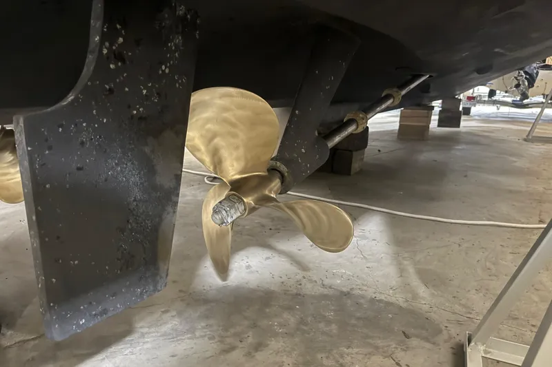 Slide: The Image of 2004 Tiara Yachts 3800 Open interior with open fridge and wooden flooring. - 49