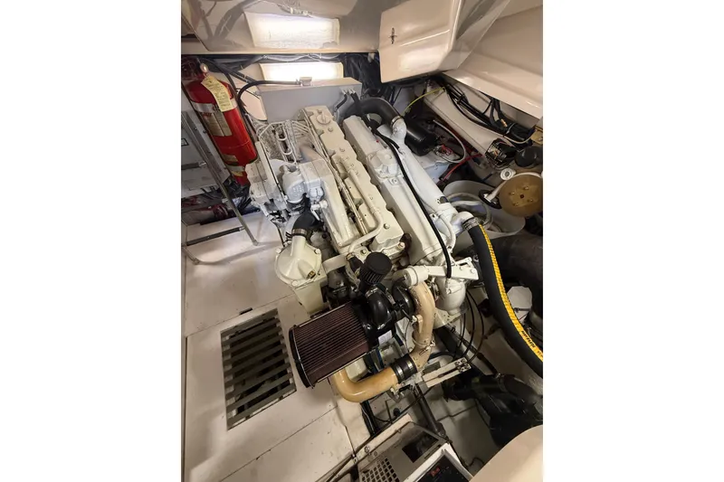 Slide: The Image of Engine room of 2004 Tiara Yachts 3800 Open, showcasing detailed mechanical components. - 65