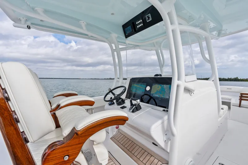 Slide: The Image of 2022 Jupiter 34 HFS boat interior with modern helm and luxurious seating. - 17