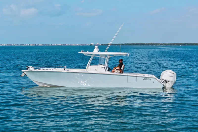 Slide: The Image of 2022 Jupiter 34 HFS boat on calm blue water with clear sky. - 2