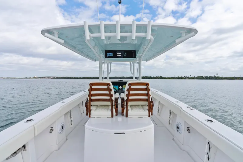 Slide: The Image of 2022 Jupiter 34 HFS boat interior with dual seats on open water. - 23