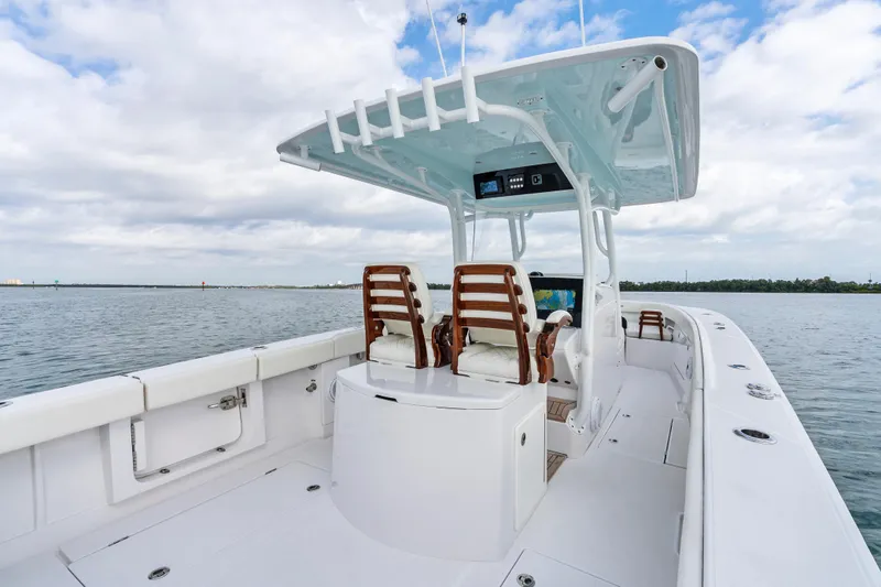 Slide: The Image of 2022 Jupiter 34 HFS boat on calm water, featuring sleek design and comfortable seating. - 24