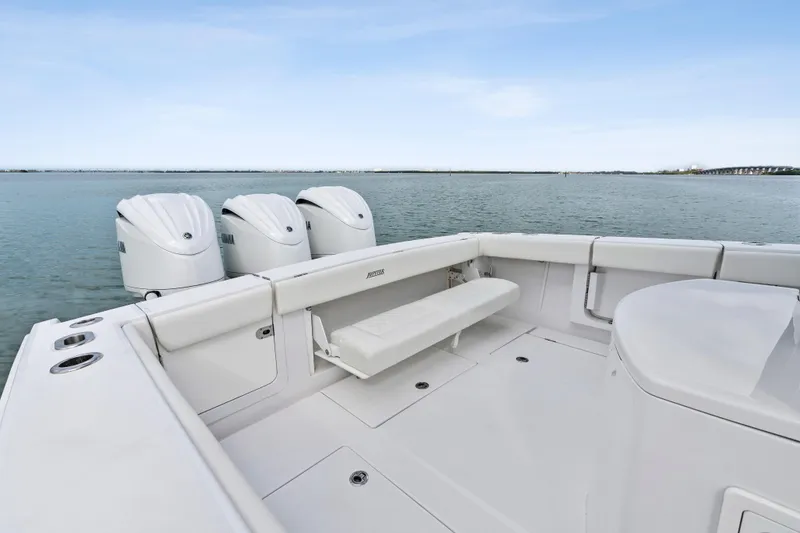 Slide: The Image of 2022 Jupiter 34 HFS boat with triple engines on calm water. - 27