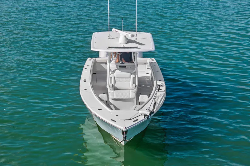 Slide: The Image of 2022 Jupiter 34 HFS boat on clear blue water, aerial view. - 3