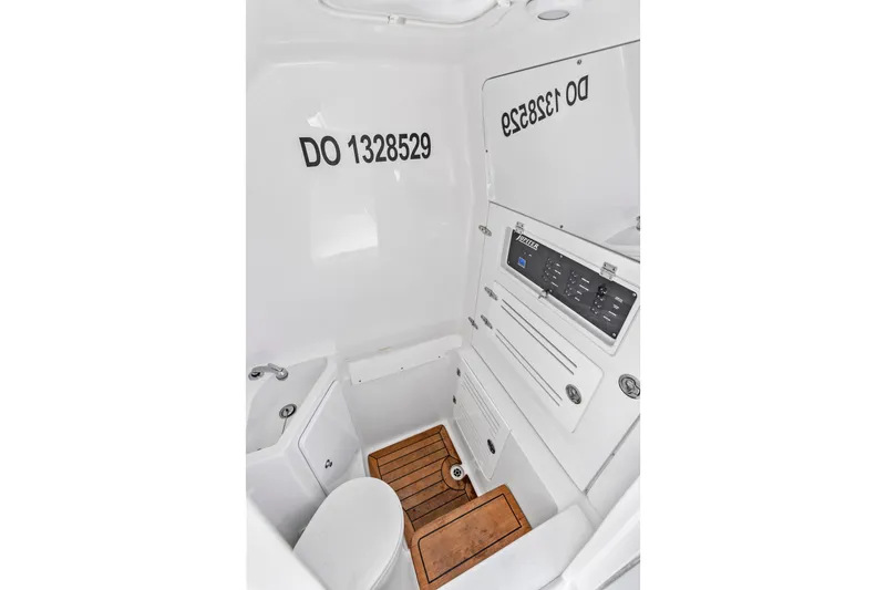 Slide: The Image of 2022 Jupiter 34 HFS boat interior with control panel and wooden flooring. - 30