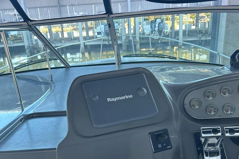 Slide: The Image of 2006 Cruisers Yachts 370 Express interior with seating and water view. - 10