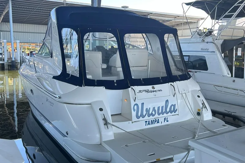 Slide: The Image of Helm of 2006 Cruisers Yachts 370 Express with steering wheel and instrument panel. - 13