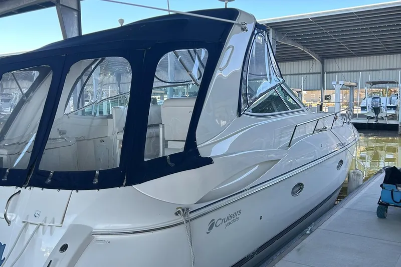 Slide: The Image of Helm of 2006 Cruisers Yachts 370 Express with steering wheel and control panel. - 15