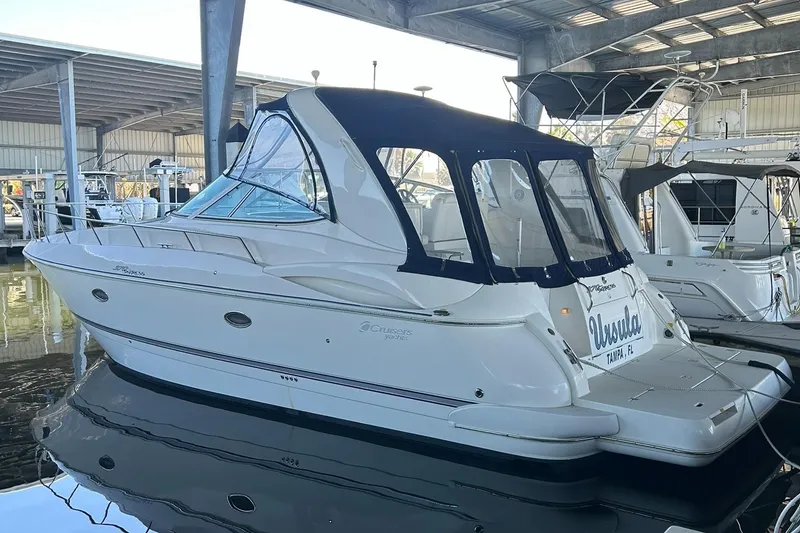 Slide: The Image of Engine compartment of 2006 Cruisers Yachts 370 Express, featuring dual engines and generator. - 18