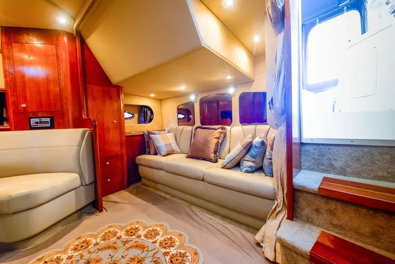 Slide: The Image of Luxurious interior of 2006 Cruisers Yachts 370 Express with elegant seating and wooden table. - 3