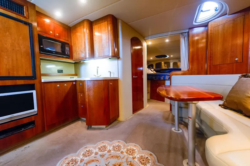 Slide: The Image of Luxurious interior of 2006 Cruisers Yachts 370 Express with elegant seating and wooden finishes. - 5