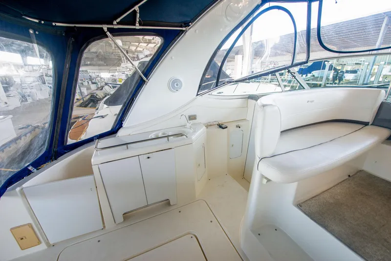 Slide: The Image of 2006 Cruisers Yachts 370 Express interior with kitchen and seating area. - 8