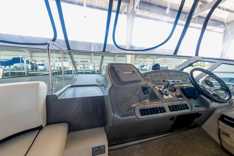 Slide: The Image of Interior cabin of 2006 Cruisers Yachts 370 Express with cozy bed and elegant wood finishes. - 9