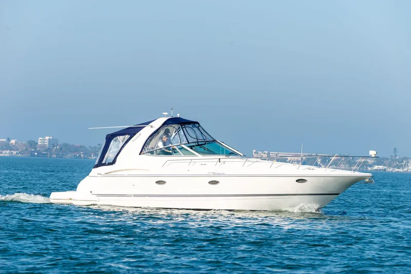 The Image of 2006 Cruisers Yachts 370 Express sailing on calm blue waters. - 0