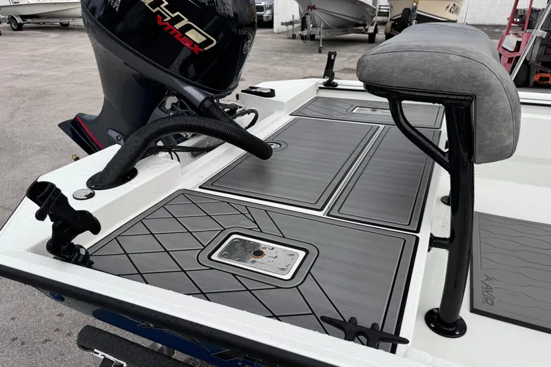 Slide: The Image of 2026 Avid 18 Rogue CC boat deck with Yamaha VMAX engine, featuring sleek design and seating. - 11