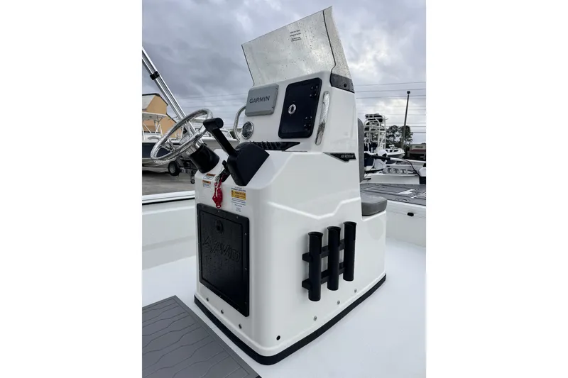 Slide: The Image of 2026 Avid 18 Rogue CC boat console with steering wheel and Garmin display. - 13