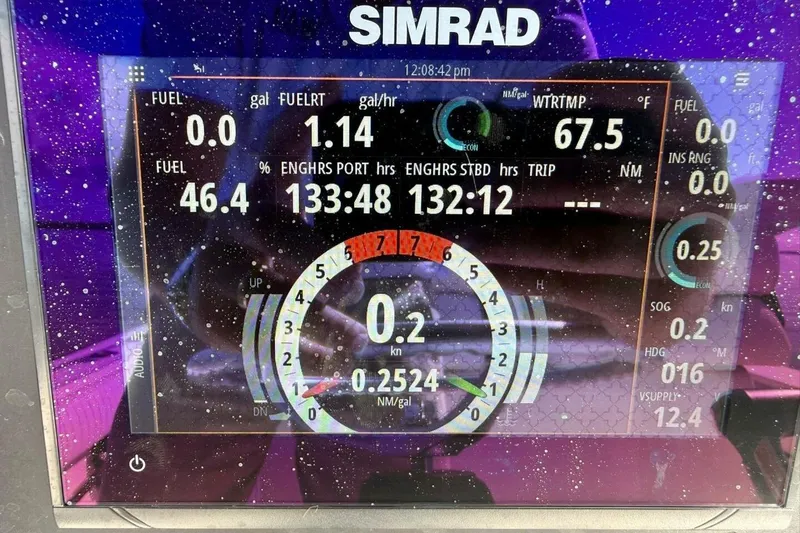 Slide: The Image of Simrad marine display on 2006 Regulator 29 Forward Seating boat, showing fuel and engine data. - 15