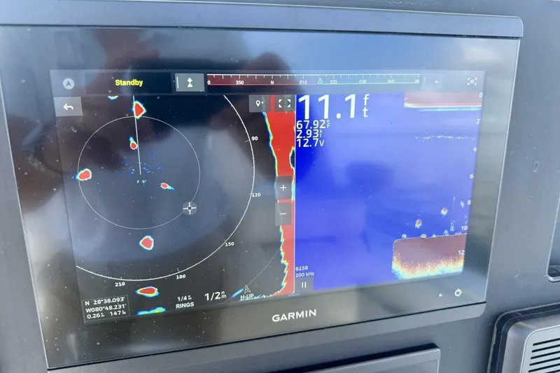 Slide: The Image of Garmin marine display on 2006 Regulator 29 Forward Seating boat, showing radar and sonar data. - 17
