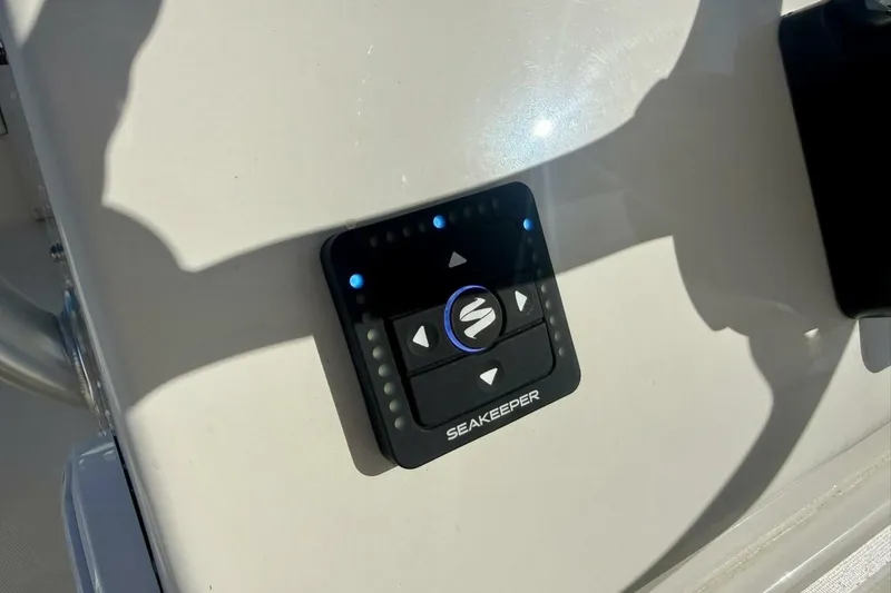 Slide: The Image of Seakeeper control panel on 2006 Regulator 29 Forward Seating boat dashboard. - 19