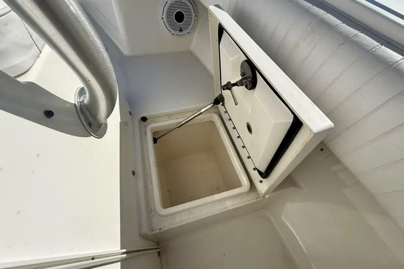 Slide: The Image of Open storage compartment on 2006 Regulator 29 Forward Seating boat interior. - 33