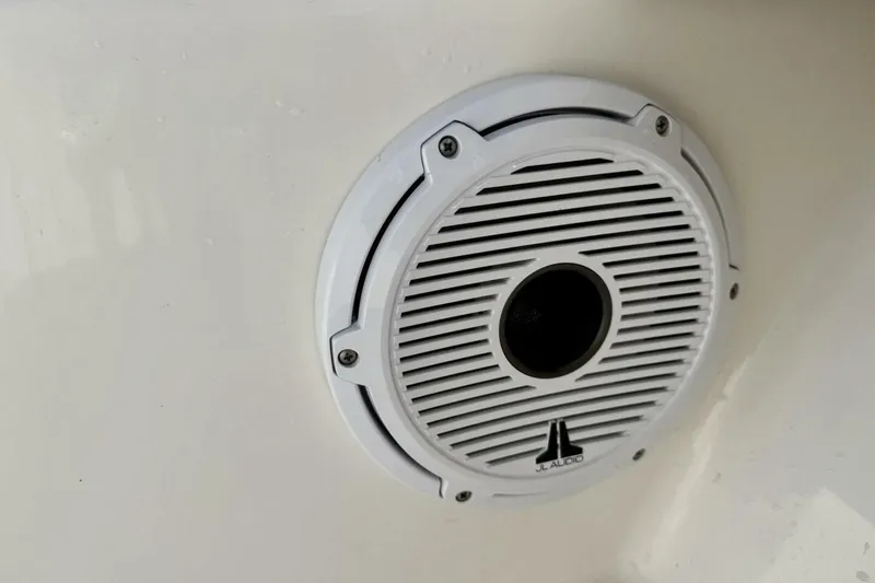 Slide: The Image of White JL Audio speaker on 2006 Regulator 29 Forward Seating boat. - 34