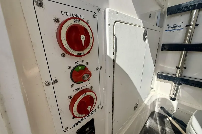 Slide: The Image of Control panel on a 2006 Regulator 29 Forward Seating boat with engine switches. - 35