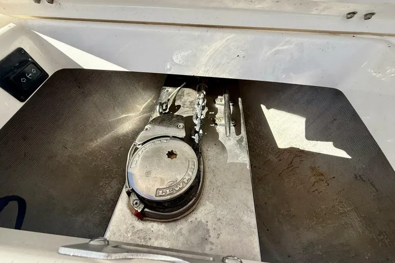 Slide: The Image of 2006 Regulator 29 Forward Seating boat anchor compartment with Lewmar windlass system. - 38