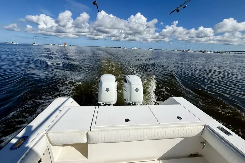 Slide: The Image of 2006 Regulator 29 Forward Seating boat cruising on open water under a blue sky. - 43