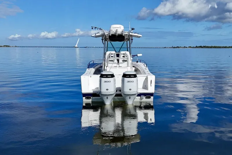 Slide: The Image of 2006 Regulator 29 Forward Seating boat on calm water with twin 300 engines. - 48
