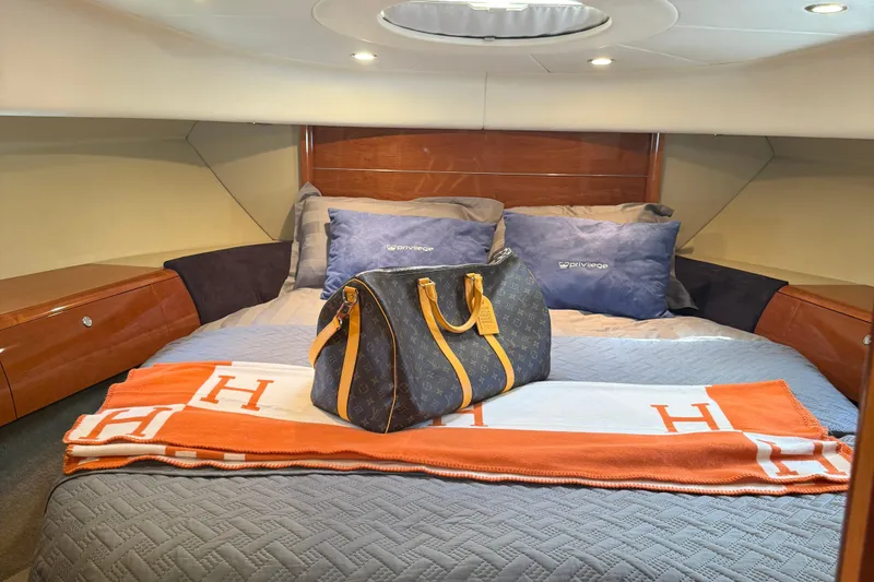 Slide: The Image of Luxurious cabin interior of 2006 Princess V48 yacht with designer bag and blanket. - 19
