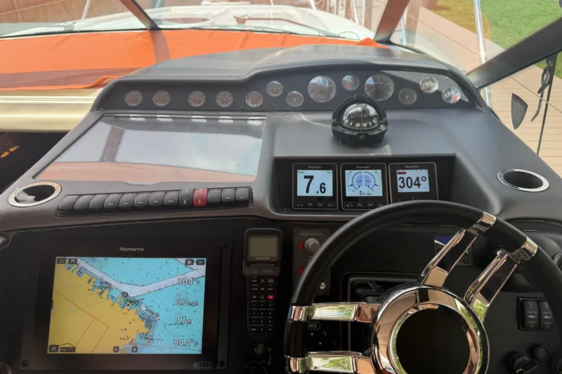 Slide: The Image of Cockpit of 2006 Princess V48 yacht with navigation instruments and steering wheel. - 2
