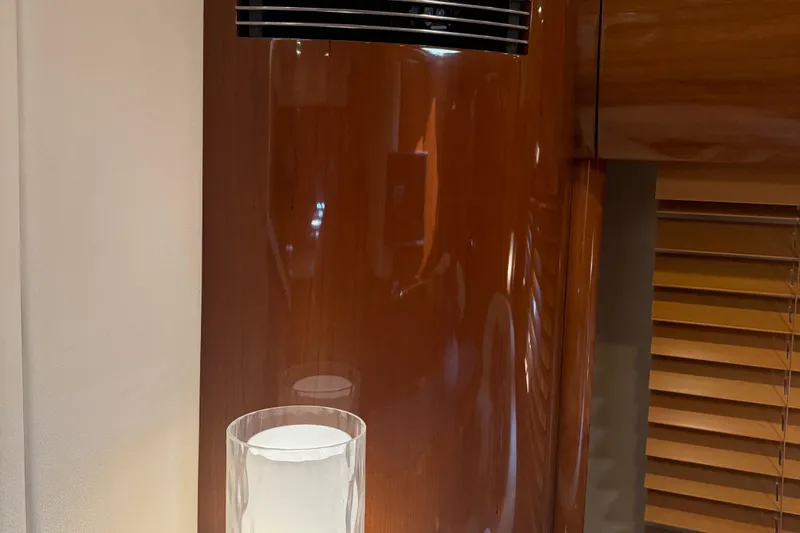 Slide: The Image of Interior of 2006 Princess V48 yacht with wooden paneling and modern lighting. - 20