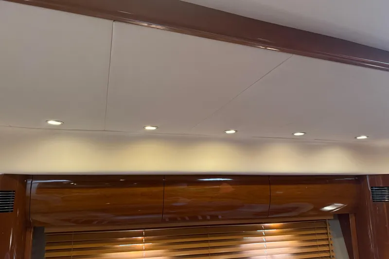 Slide: The Image of Interior ceiling of 2006 Princess V48 yacht with recessed lighting and wooden accents. - 24