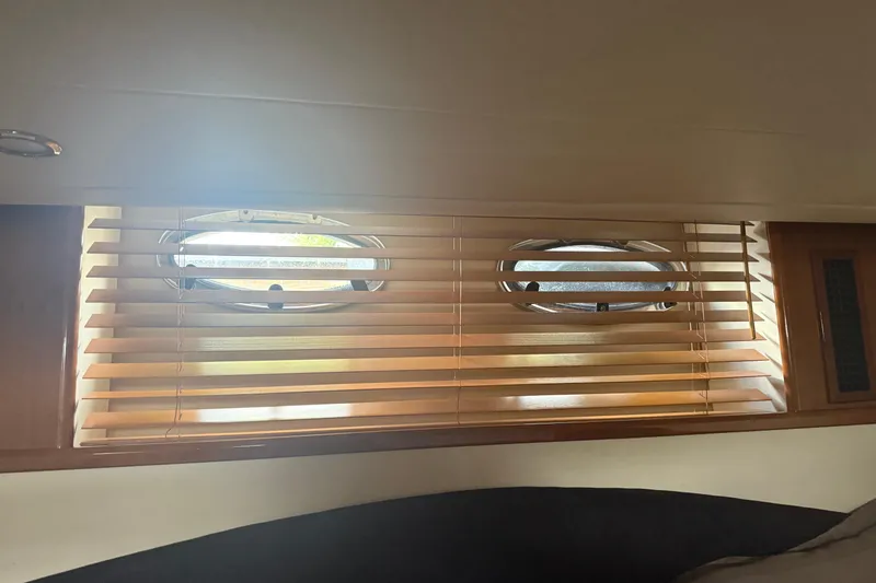 Slide: The Image of Interior of 2006 Princess V48 yacht with wooden blinds and portholes. - 25