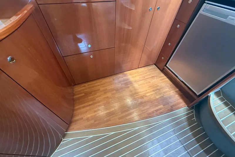 Slide: The Image of Interior of 2006 Princess V48 yacht with wooden cabinetry and flooring. - 28
