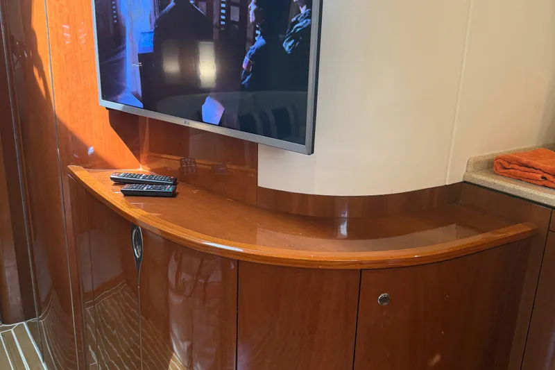 Slide: The Image of Interior of 2006 Princess V48 yacht with TV and wooden cabinetry. - 34