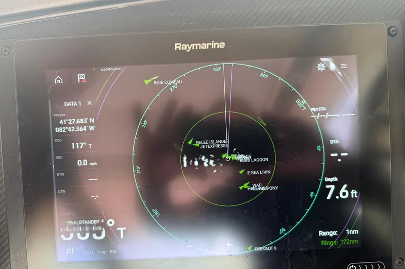 Slide: The Image of Raymarine navigation display on 2006 Princess V48 yacht, showing coordinates and depth. - 4
