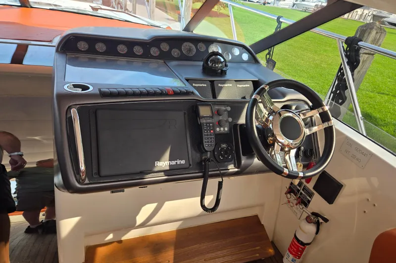 Slide: The Image of Interior helm of 2006 Princess V48 yacht with Raymarine navigation system. - 54