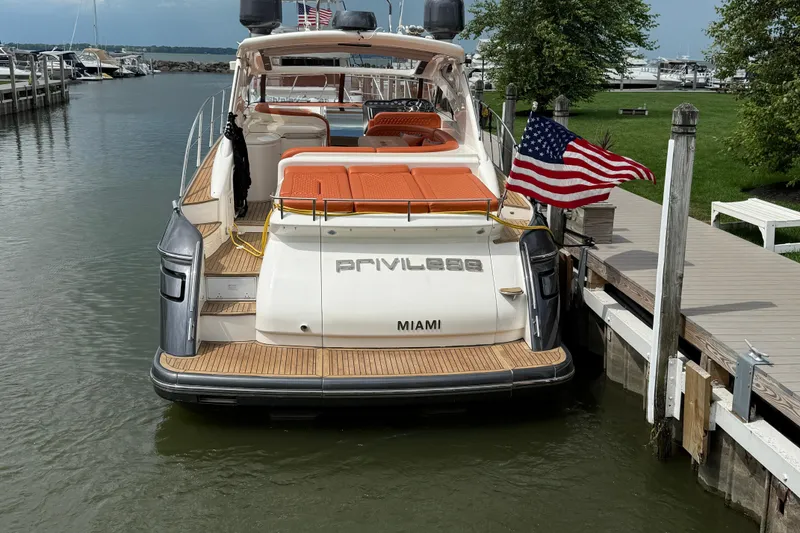 Slide: The Image of Luxury 2006 Princess V48 yacht docked, displaying American flag, with "Privilege" and "Miami" text. - 7